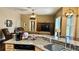 Open-concept kitchen with granite countertops overlooking the living room at 1138 Lumsden Trace Cir, Valrico, FL 33594