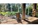 Screened patio with tile flooring, seating, and view of the lush green backyard at 1138 Lumsden Trace Cir, Valrico, FL 33594