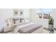 Bright and serene bedroom with minimalist decor, soft textures, and a tranquil ambiance at 11296 Curio Dr, Brooksville, FL 34613