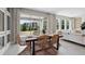 Bright dining area with stylish wicker chairs, tile floors, and sliding glass doors to the outdoor space at 11352 Curio Dr, Brooksville, FL 34613