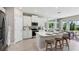 Bright kitchen featuring modern white cabinets, stainless steel appliances, and a center island at 11352 Curio Dr, Brooksville, FL 34613