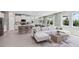 Spacious living area featuring a kitchen with bar seating, modern furnishings, and an open floor plan at 11352 Curio Dr, Brooksville, FL 34613