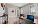 Home office with large windows, desk, and paneled wall feature at 11352 Curio Dr, Brooksville, FL 34613