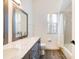 Stylish bathroom with double sinks, granite countertops, and a shower-tub combo for added convenience at 305 Lake Tahoe Ct, Englewood, FL 34223