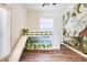 Playful bedroom featuring a bunk bed with a slide and jungle-themed wallpaper at 305 Lake Tahoe Ct, Englewood, FL 34223