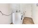 Bright laundry room featuring modern appliances and wood-look laminate flooring at 305 Lake Tahoe Ct, Englewood, FL 34223