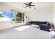 Comfortable living room with carpet, a large window overlooking a lake, and a sectional sofa at 305 Lake Tahoe Ct, Englewood, FL 34223