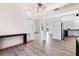 Open concept living and kitchen area with wood flooring and modern appliances at 305 Lake Tahoe Ct, Englewood, FL 34223