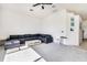 Spacious living room features a large sectional sofa, ceiling fan and bright, neutral decor at 305 Lake Tahoe Ct, Englewood, FL 34223
