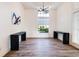 Bright living room featuring a large window, modern chandelier and elegant decor at 305 Lake Tahoe Ct, Englewood, FL 34223