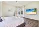 Spacious main bedroom with hardwood floors and an outdoor view at 305 Lake Tahoe Ct, Englewood, FL 34223