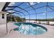 Inviting screened-in pool with lake view at 305 Lake Tahoe Ct, Englewood, FL 34223