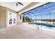 A pool area featuring a pool, seating, and a lake view at 305 Lake Tahoe Ct, Englewood, FL 34223