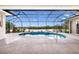 A relaxing pool area features seating, a pool, and a lake view at 305 Lake Tahoe Ct, Englewood, FL 34223