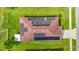 Top-down aerial of home with solar panels on the roof and green lawn at 6812 Gideon Cir, Zephyrhills, FL 33541