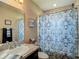 Bathroom featuring a shower-tub combo with a decorative shower curtain, plus a vanity sink with decor at 6812 Gideon Cir, Zephyrhills, FL 33541