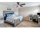 Comfortable bedroom featuring warm wood floors, beachy decor, and a serene atmosphere at 6812 Gideon Cir, Zephyrhills, FL 33541