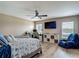 Comfortable bedroom with a workspace, reading chair, and beach-themed décor for a relaxing retreat at 6812 Gideon Cir, Zephyrhills, FL 33541