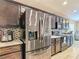 Modern kitchen featuring stainless steel appliances and granite countertops at 6812 Gideon Cir, Zephyrhills, FL 33541