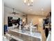 Open-concept design with a dining area, spacious living room, sleek black appliances, and modern finishes at 6812 Gideon Cir, Zephyrhills, FL 33541