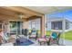 Comfortable screened-in lanai with a ceiling fan, seating and a grill; perfect for relaxing at 6812 Gideon Cir, Zephyrhills, FL 33541