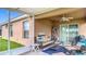 Inviting screened-in patio with cozy seating and a ceiling fan for added comfort at 6812 Gideon Cir, Zephyrhills, FL 33541