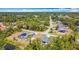 Aerial view of a community with mature trees, single Gathering homes, and beautiful Florida scenery at 3018 Oceanside St, North Port, FL 34286
