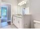 Bathroom with granite countertops, toilet area, and easy bedroom access at 3018 Oceanside St, North Port, FL 34286
