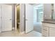Bathroom featuring granite vanity, private toilet area, and entrance to the bedroom at 3018 Oceanside St, North Port, FL 34286