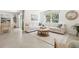 Spacious living room featuring tile floors and a large sectional sofa at 2189 Gold Rd, Spring Hill, FL 34608