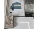 A professionally designed color scheme featuring coordinated paint, stone, and countertop selections at 14351 Carolina Chickadee Rd, Weeki Wachee, FL 34614