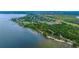 Stunning aerial view of a waterfront community with mature trees and lush landscaping at 205 Bengal Cir, Oldsmar, FL 34677