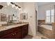 Bathroom features double sinks, tub, and walk-in shower at 205 Bengal Cir, Oldsmar, FL 34677