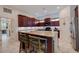 Kitchen features stainless steel appliances, breakfast bar, and tile flooring at 205 Bengal Cir, Oldsmar, FL 34677