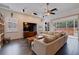 Spacious living room with tile floors, a ceiling fan, and access to the outdoor patio at 205 Bengal Cir, Oldsmar, FL 34677
