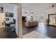 Open-concept living room with tile flooring, a ceiling fan, and a sliding glass door to the patio at 205 Bengal Cir, Oldsmar, FL 34677