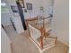 Bright, carpeted staircase featuring a white wood railing and balusters leading to the upper level at 205 Bengal Cir, Oldsmar, FL 34677