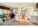 Open-concept kitchen adjacent to the living area, featuring a breakfast bar and stainless steel appliances at 5728 Colonial Dr, New Port Richey, FL 34653