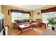 Inviting living room with a plush sofa, armchair, and a view of a cozy fireplace at 5728 Colonial Dr, New Port Richey, FL 34653