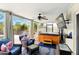 Screened sunroom offering comfortable seating, a hot tub, and outdoor access at 5728 Colonial Dr, New Port Richey, FL 34653