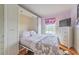 This bedroom boasts a Murphy bed, natural light, and a built-in dresser at 15200 Rawls Rd, Sarasota, FL 34240