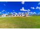 Exterior of the barn featuring a large grassy area with white fencing and a metal roof at 15200 Rawls Rd, Sarasota, FL 34240