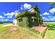 Exterior featuring green vines growing all over the side of the building at 15200 Rawls Rd, Sarasota, FL 34240