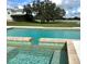 Relaxing pool and view of the property with verdant landscape and equestrian estate at 15200 Rawls Rd, Sarasota, FL 34240