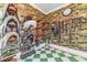 Tack room with saddle and bridle racks, wallpapered walls, and tile floor at 15200 Rawls Rd, Sarasota, FL 34240