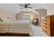 Cozy bedroom featuring a ceiling fan, neutral walls, and comfortable furniture for a relaxing atmosphere at 10230 289Th E St, Myakka City, FL 34251