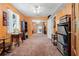 Bonus room with orange walls, carpet, and vintage decor at 10230 289Th E St, Myakka City, FL 34251