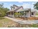 Charming two-story home with a welcoming front porch and well-maintained landscaping at 10230 289Th E St, Myakka City, FL 34251