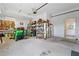 Spacious garage with tools, equipment, and ample space for storage at 10230 289Th E St, Myakka City, FL 34251
