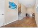 Open living room with staircase, tile flooring, and lots of natural light at 10230 289Th E St, Myakka City, FL 34251